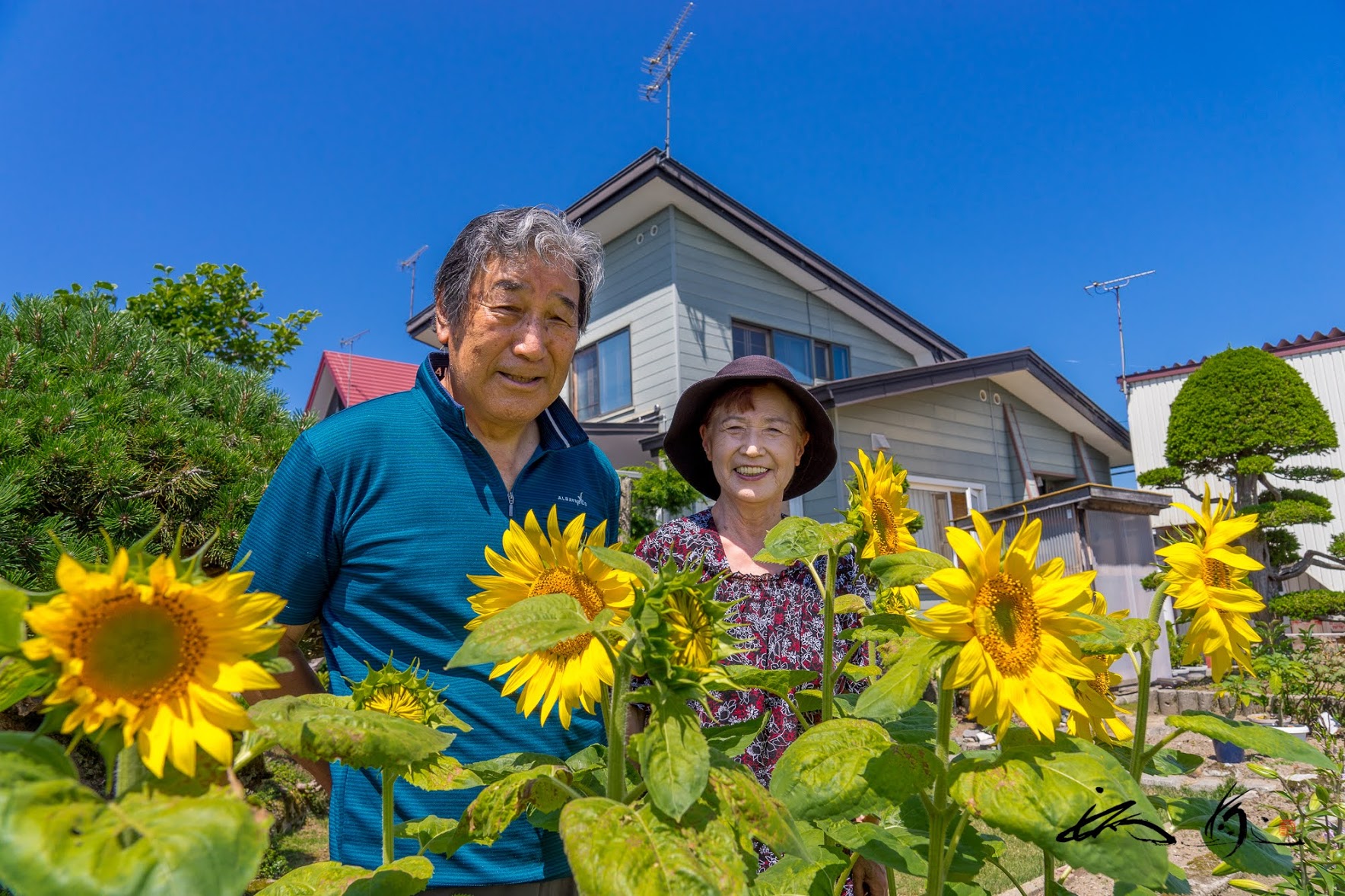 町民の笑顔とひまわりさん