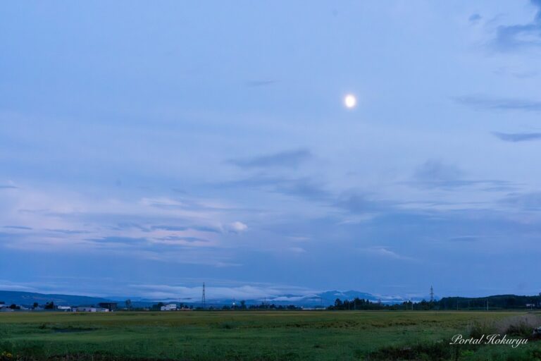 The moon floating in the night sky after the rain